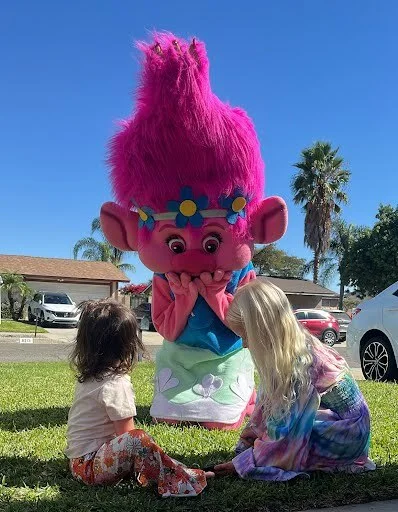 Pink Troll party character in Austin